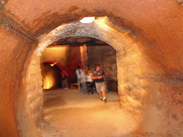 Alex in a tunnel in Lockport Cave