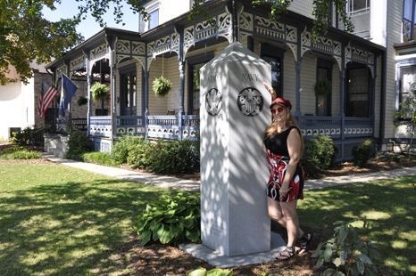 Karen Duquette and a U.S. Navy plaque