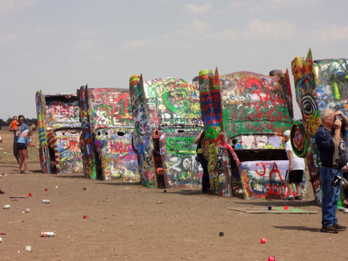 Brightly-painted Cadillacs, all in a row at Cadillac Ranch in Texas