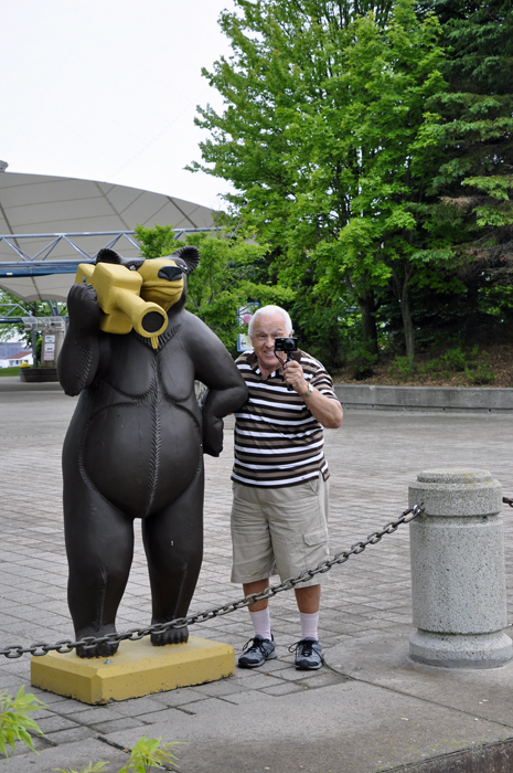 Lee Duquette helps the bear do his filming