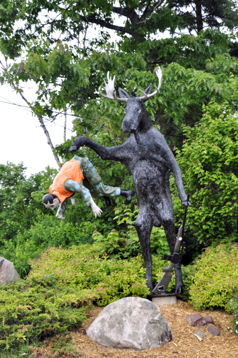 moose and humter statue