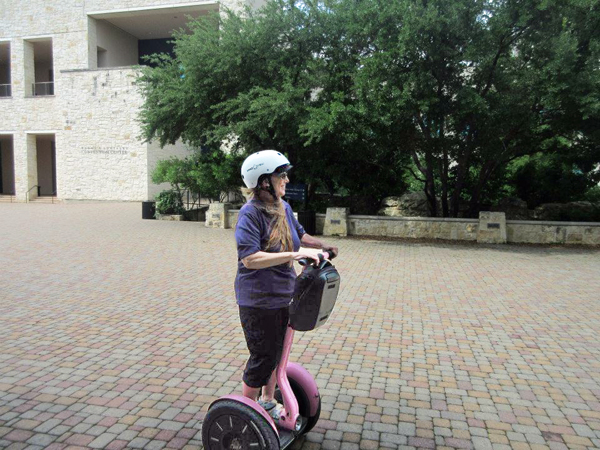 Karen on a pink Segway