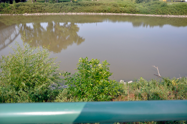Red River and the railing by the monument
