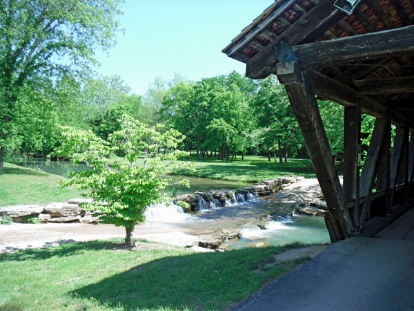 Long Pine Crossing Covered Bridge and a waterfall