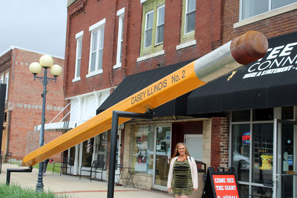 Karen Duquette and a large pencil