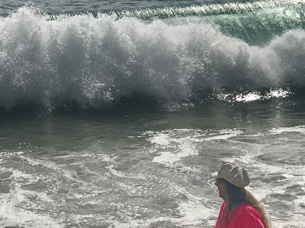 Karen Duquette at West Jetty Beach with big waves