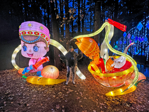 Karen Duquette and a lighted display