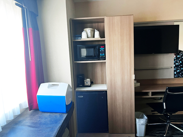 window, refrigerator, Micorowave and desk