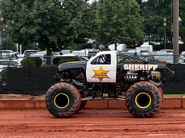 Ricky Fowler in the Sheriff Monster truck 