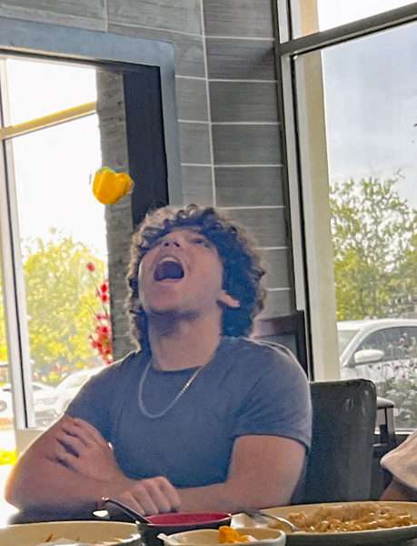 anthony Rosenthal catching food thrown in the air