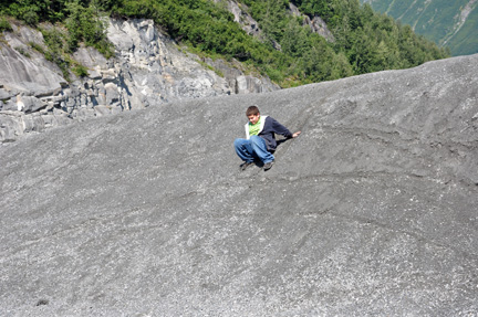 Alex sliding down the hillside