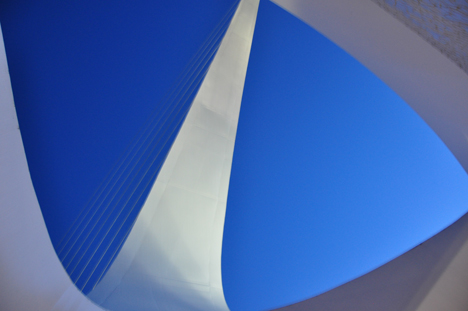 looking up at the sky and the pylon from under the bridge